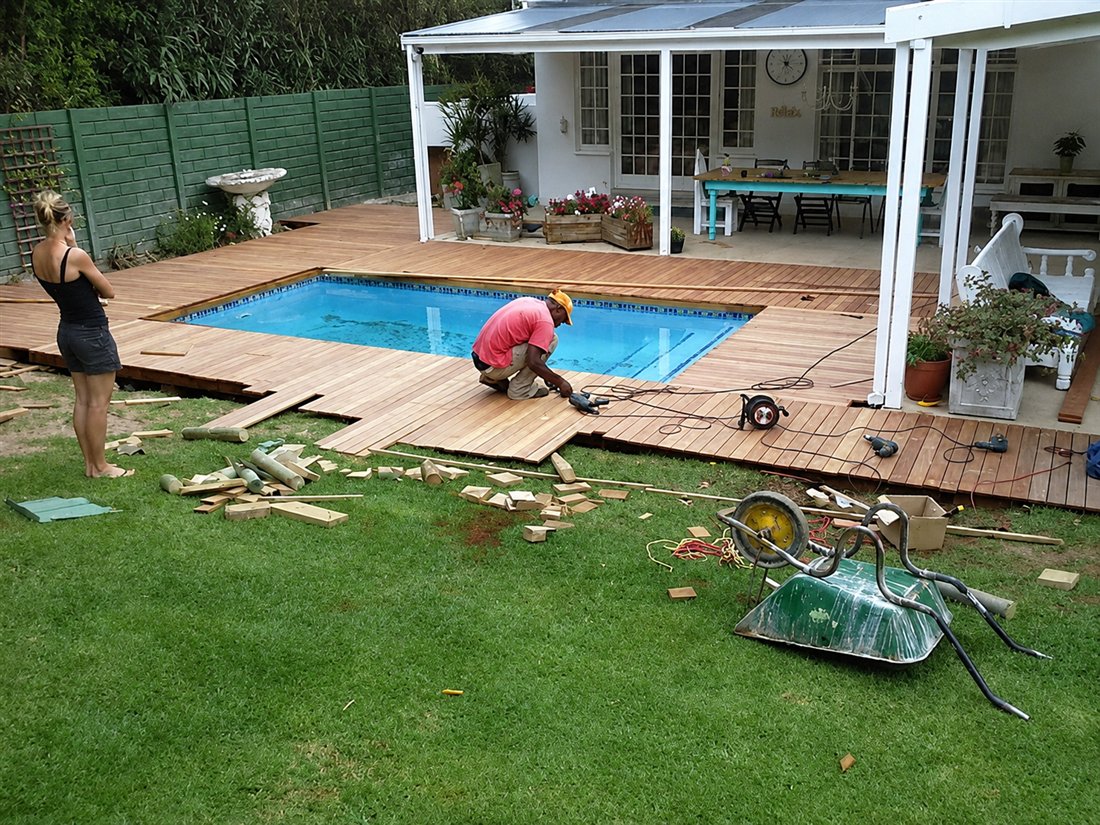 The Rod Timber Products team building a timber deck around a pool