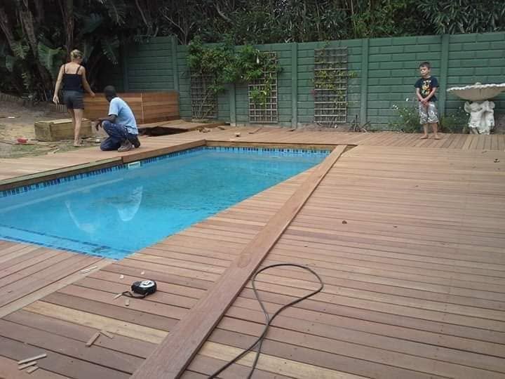 Timber decking installed around a swimming pool